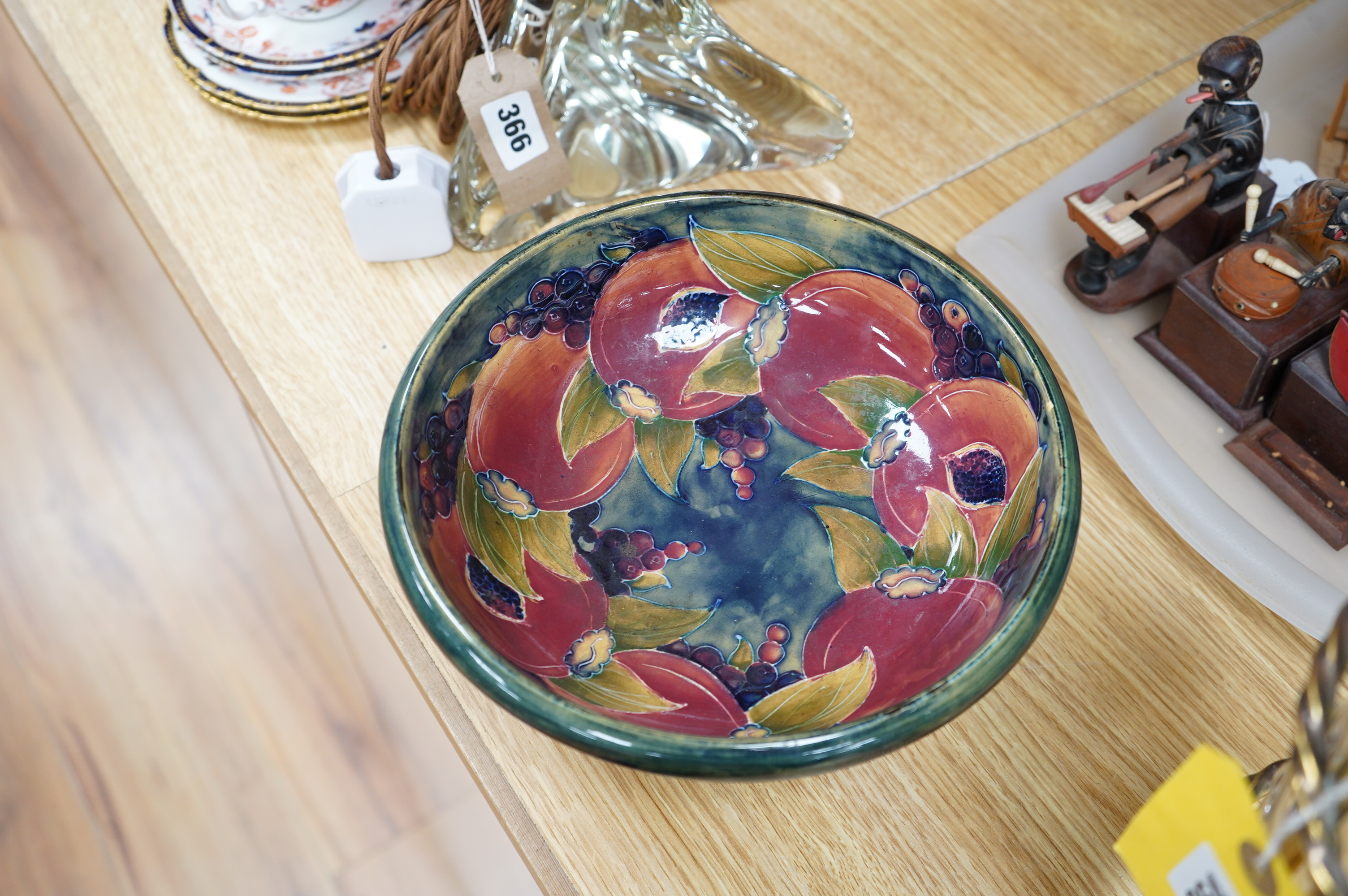 An early Moorcroft pomegranate pattern footed bowl, diameter 23cm.